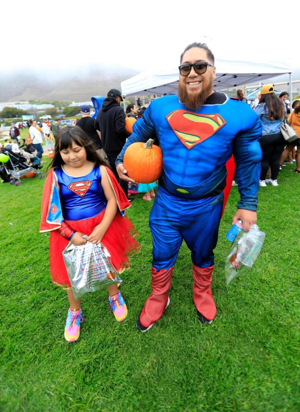 Tim Tarrant and Kailea, 9, of Guadalupe show off their costumes at Pismo Beach’s 33rd annual Pumpkins in the Park (formerly Pumpkins on the Pier) Halloween celebration, on Saturday, Oct. 30, 2021, at Dinosaur Caves Park.