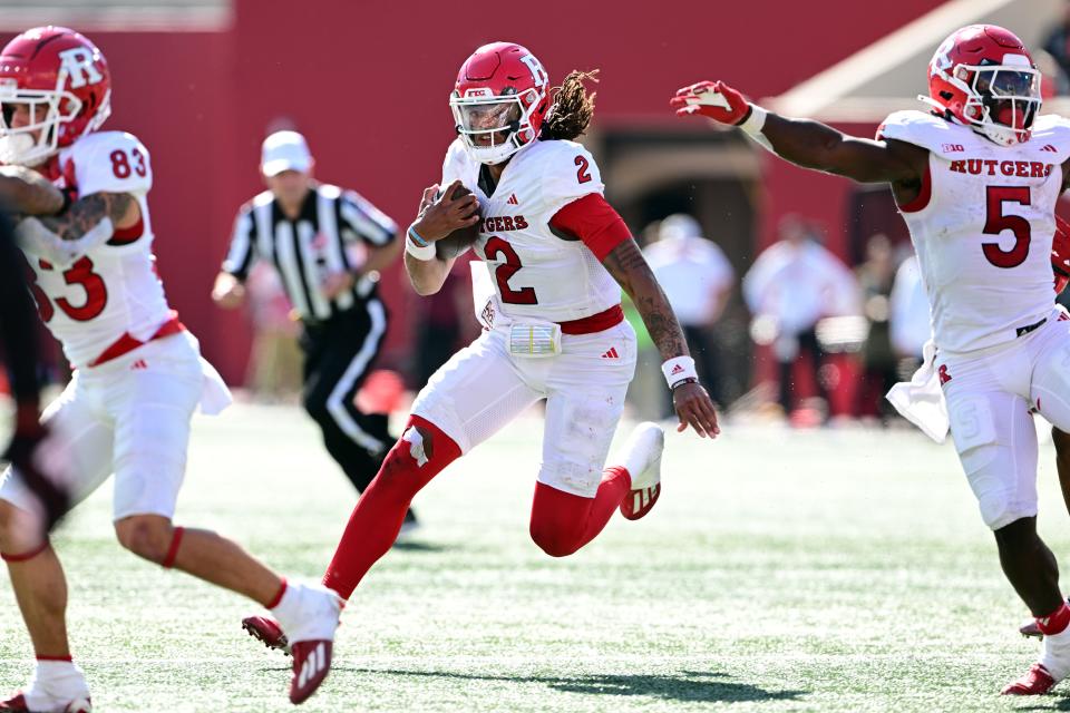 Oct 21, 2023; Bloomington, Indiana, USA; Rutgers Scarlet Knights quarterback Gavin Wimsatt (2) runs the ball during the second half of the game against the Indiana Hoosiers at Memorial Stadium. Mandatory Credit: Marc Lebryk-USA TODAY Sports