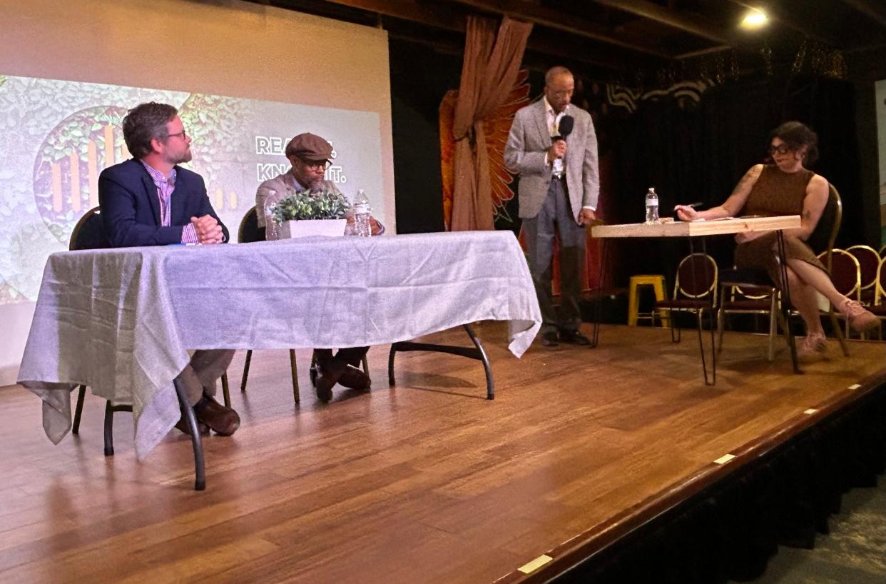 Connect Savannah Publisher Rufus Friday (standing) introduces moderator Coco Guthrie-Papy ahead of the Savannah-Chatham School Board forum on Sunday May 19, 2024 at Front Porch Improv featuring district 7 incumbent Michael Johnson (left) and challenger Jay Jones.