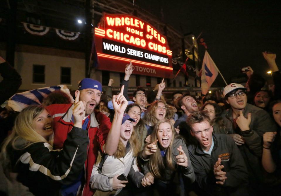 Cubs fans celebrate the World Series win outside Wrigley Field. (AP)