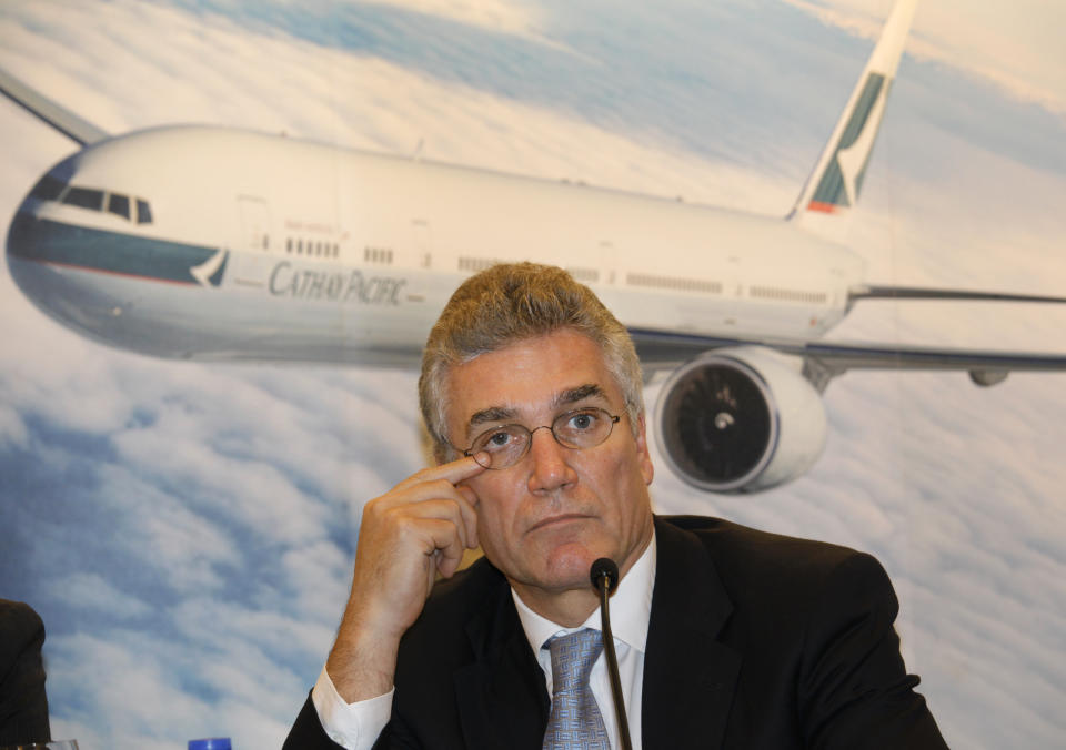 Cathay Pacific Airways Chairman Christopher Pratt reacts as he attends a press conference for the airline's annual results in Hong Kong Wednesday, March 14, 2012. Cathay Pacific Airways, Hong Kong's biggest airline, says profit fell 61 percent last year, hurt by persistently high jet fuel prices and weakness in the world's major economies. The airline posted a profit of 5.5 billion Hong Kong dollars ($709 million) for 2011, down from a record HK$14 billion the year before. Earnings per share fell to HK$1.40 from HK$3.57. (AP Photo/Vincent Yu)