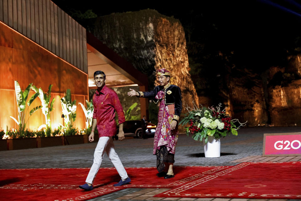 FILE- Indonesian President Joko Widodo, right, welcome British Prime Minister Rishi Sunak, left, at the Welcoming Dinner during G20 Leaders' Summit, at the Garuda Wisnu Kencana Cultural Park, in Badung, Bali, Indonesia, Nov. 15, 2022. In his first month as Britain's prime minister, Sunak has stabilized the economy, reassured allies from Washington to Kyiv and even soothed the European Union after years of sparring between Britain and the bloc. But Sunak’s challenges are just beginning. He is facing a stagnating economy, a cost-of-living crisis – and a Conservative Party that is fractious and increasingly unpopular after 12 years in power. (Willy Kurniawan/Pool Photo via AP, FIle)