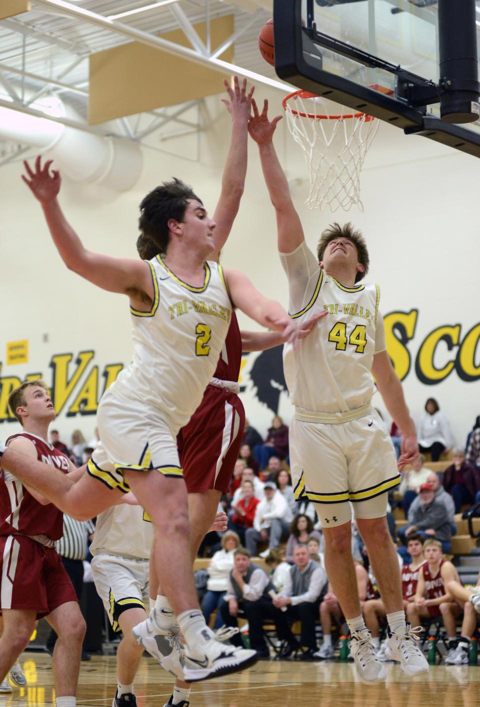 Tri-Valley's Max Lyall, left, and Erik Neal go up for a blocked shot against Dover last season. Lyall and Neal are two of the returning letter winners for the Scotties, who will aim to defend their MVL Big School title.