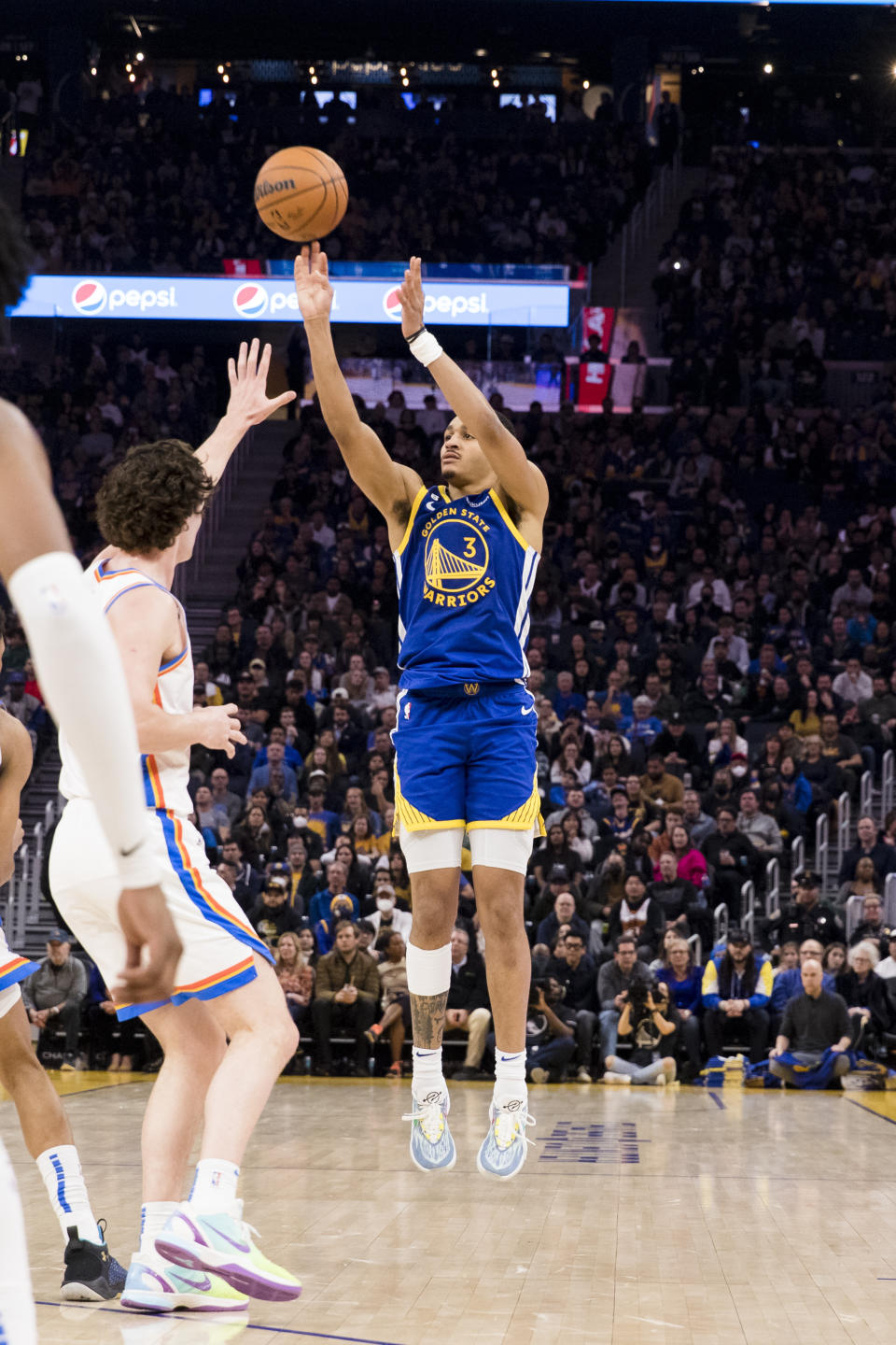 Golden State Warriors guard Jordan Poole (3) takes a 3-point shot against the Oklahoma City Thunder during the first half of an NBA basketball game in San Francisco, Monday, Feb. 6, 2023. (AP Photo/John Hefti)