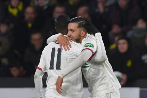 Rayan Cherki (R) is embraced by one of his Lyon teammates during his sparkling performance in a French Cup win over Nantes