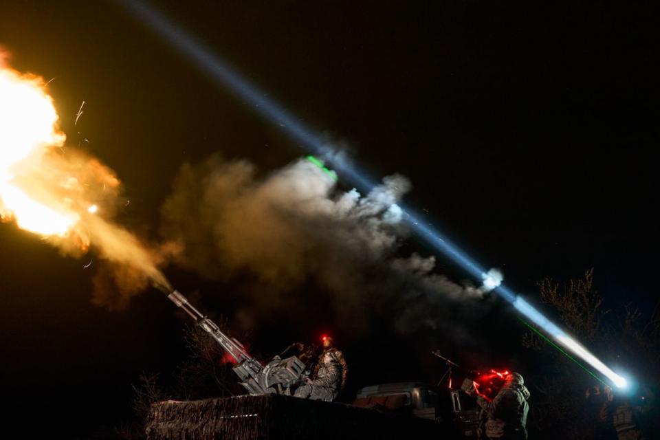 Soldiers of the Armed Forces of Ukraine from the unit of the mobile air defense group shoot down enemy drones using the ZU-23-2 Soviet 23-mm twin anti-aircraft gun in an undisclosed location in Ukraine on April 16, 2024. (Kostiantyn Liberov/Libkos/Getty Images)