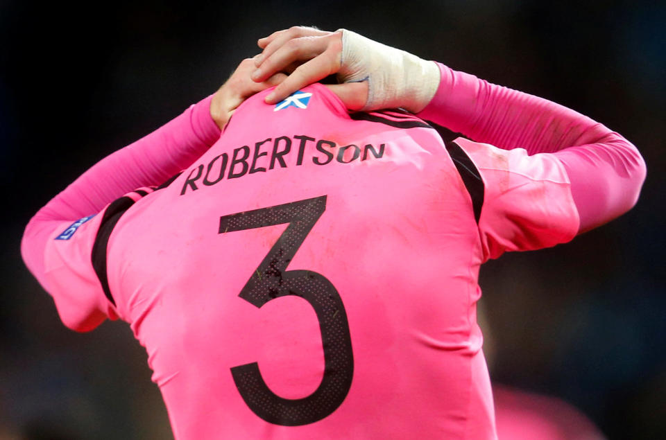 Small fish in a little pond? Liverpool’s summer signing from Hull City Andrew Robertson looks dejected as Scotland fail to qualify