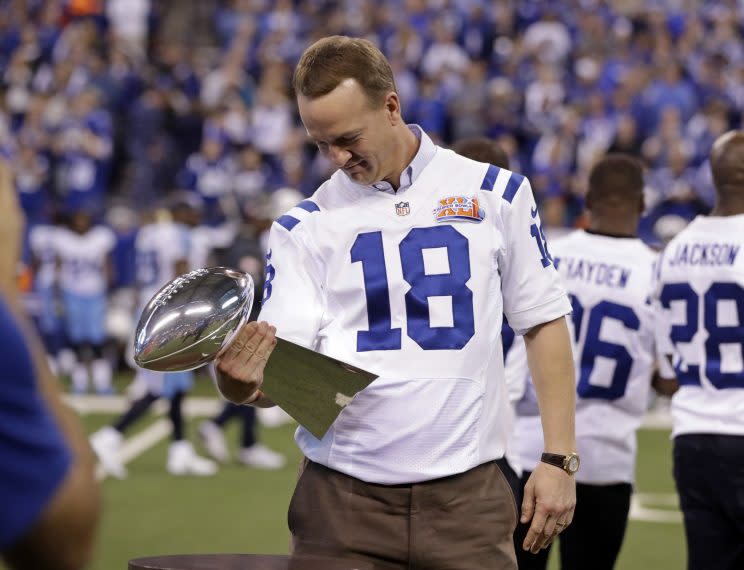 Peyton Manning looks at the Lombardi Trophy during a celebration for the 2006 Colts championship team last year. (AP)
