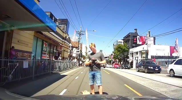 The skater then appears to take pictures of the car's registration plate as if to insinuate the driver was in the wrong. Source: YouTube/ Dash Cam Owners Australia