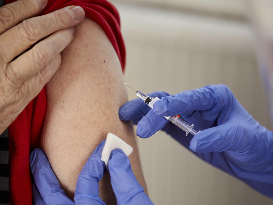 close up of man getting a vaccine 