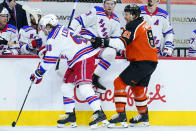 Philadelphia Flyers' Carsen Twarynski (81) collides with New York Rangers' Brendan Lemieux (48) during the second period of an NHL hockey game, Wednesday, Feb. 24, 2021, in Philadelphia. (AP Photo/Matt Slocum)