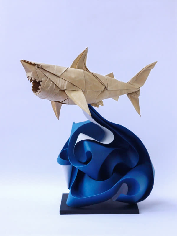 Origami art - Great White Shark. Refolded and added a "crazy wave".