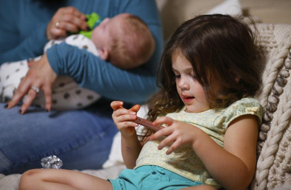 Stella Detwiler keeps her mom, Carlla, and brother David company. (Jeff Lange)