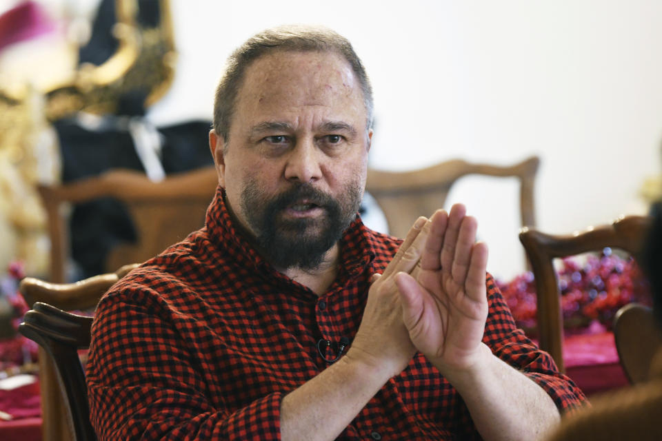 FILE - Michigan State University professor Marco Díaz-Muñoz talks during an interview, Feb. 16, 2023, at his home in Lansing, Mich. New gun laws take effect Tuesday, Feb. 13, 2024, in Michigan on the one-year anniversary of a shooting at Michigan State University that claimed the lives of three students and left five in critical condition. The gunman entered Díaz-Muñoz's class in Berkey Hall that day and killed two students and left others with critical wounds. (Clarence Tabb Jr./Detroit News via AP, File)