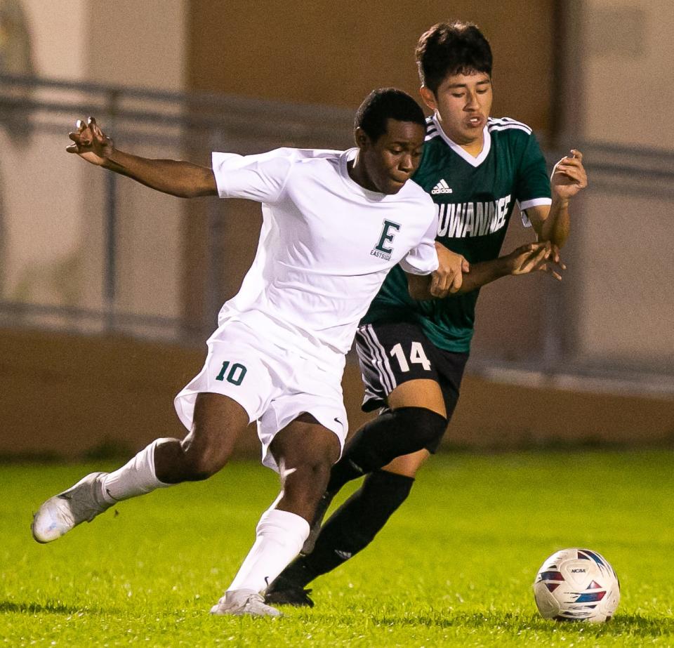 Gainesville Eastside's Jayven Cromwell (10) winds up for a shot while being defended by Suwannee midfielder Denzel Yaxon (14) in the first half.