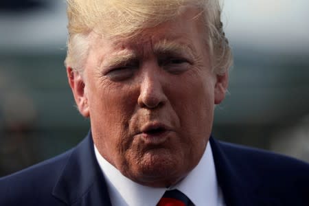 FILE PHOTO: U.S. President Donald Trump speaks to reporters before boarding Air Force One to return to Washington from Morristown Municipal Airport in Morristown, New Jersey