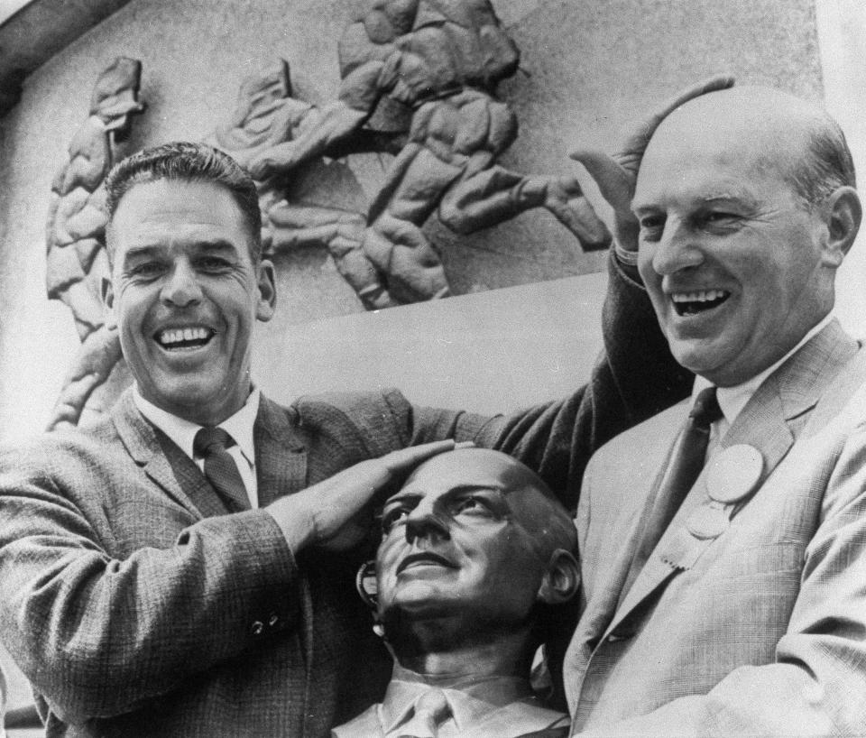 Paul Brown, former coach for the Cleveland Browns, was inducted into the Pro Football Hall of Fame in Canton, Ohio, on August 5, 1967. Otto Graham (left), himself a member, presented Brown for enshrinement.