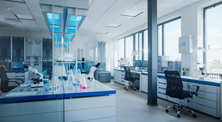 Modern Medical Research Laboratory with Computer, Microscope, Glassware with Biochemicals on the Desk. Scientific Lab Biotechnology Development Center Full of High-Tech Equipment. Biomedical technology stocks