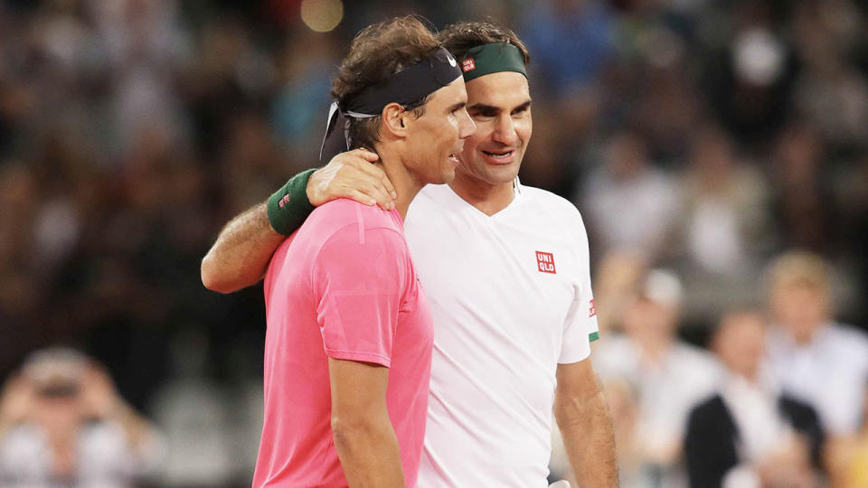 Roger Federer and Rafael Nadal hug after a tennis match at Cape Town Stadium as part of an exhibition game held to support the education of African children, on February 8, 2020 in Cape Town, South Africa.