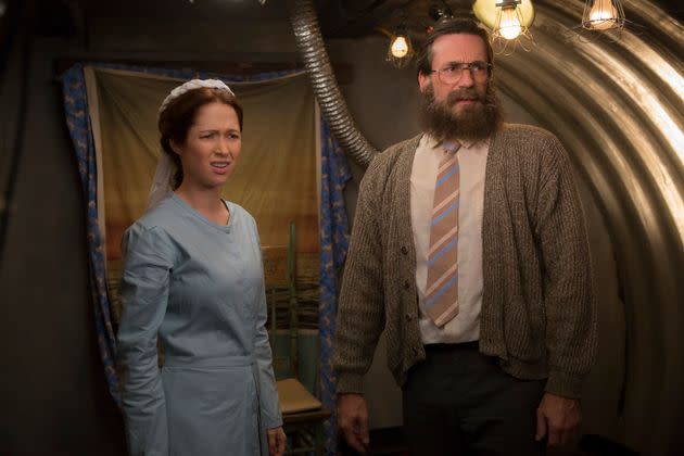 Ellie Kemper as Kimmy Schmidt and Jon Hamm as Reverend Richard Wayne Gary Wayne in 