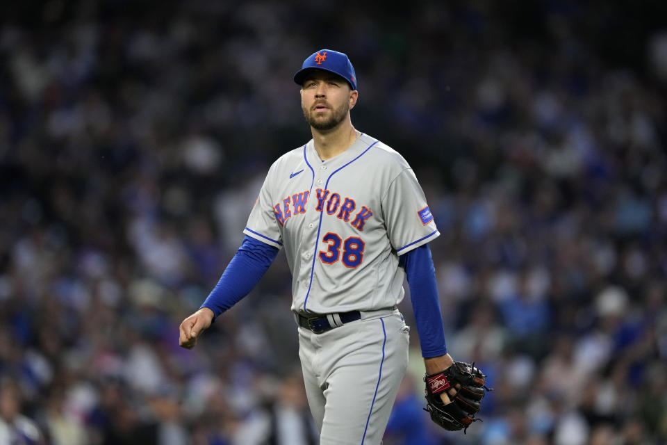 New York Mets starting pitcher Tylor Megill heads to the dugout after being pulled from the baseball game by manager Buck Showalter during the fourth inning against the Chicago Cubs on Tuesday, May 23, 2023, in Chicago. (AP Photo/Charles Rex Arbogast)