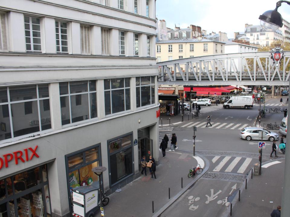 The author's hotel view consisted of a subway station and a grocery store.