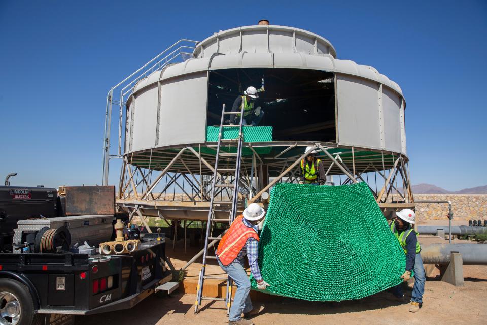 Workers maintain a cooling tower used to cool the water during the process of extracting minerals at an El Paso brine extraction plant that plans to get millions of gallons of brine, or saline effluent, daily from the Kay Bailey Hutchison Desalination Plant.