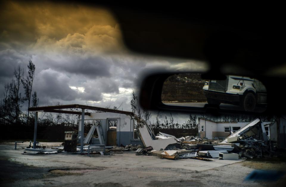 A shattered gas station is seen at the aftermath of Hurricane Dorian in Freetown, Grand Bahama, Bahamas, Friday Sept. 13, 2019. (AP Photo/Ramon Espinosa)