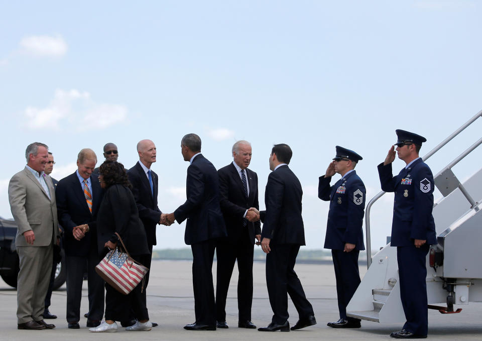 <p>Obama greets Republican Florida Gov. Rick Scott. Biden greets Republican Florida Sen. Marco Rubio as the president and vice president arrive in Orlando, Fla., to meet with families of the victims of the Pulse nightclub shooting, June 16, 2016. (Carlos Barria/Reuters) </p>