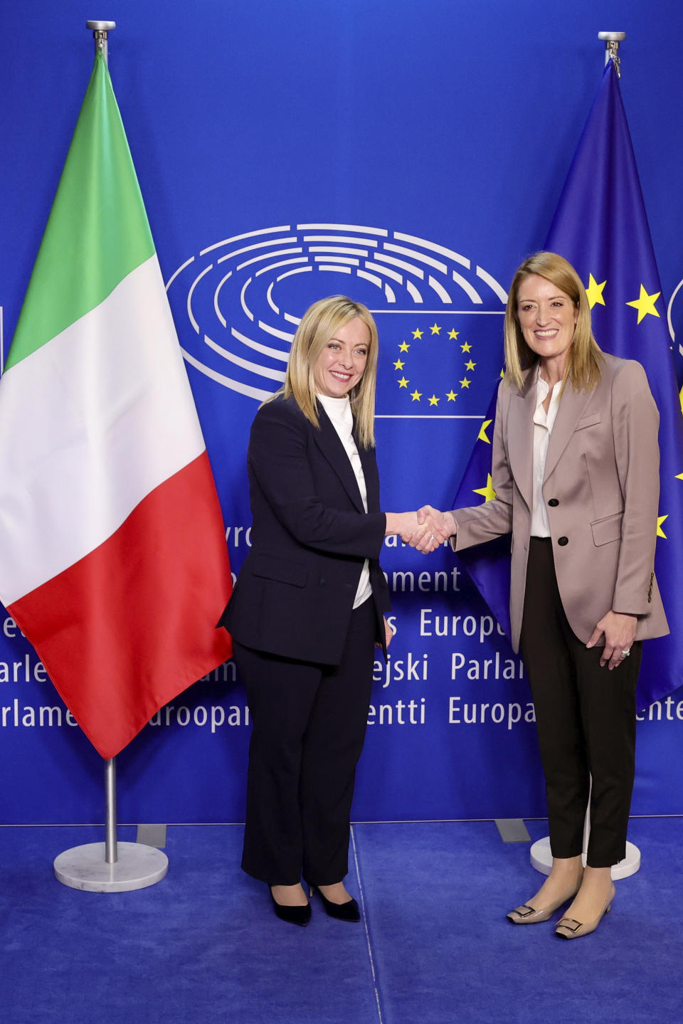 European Parliament President Roberta Metsola, right, greets Italian Prime Minister Giorgia Meloni at the European Parliament in Brussels, Thursday, Nov. 3, 2022. New Italian Prime Minister Giorgia Meloni visits EU officials on Thursday, and it is no ordinary visit of the leader of a European Union founding nation to renew unshakable bonds with the 27-nation bloc. (AP Photo/Olivier Matthys)