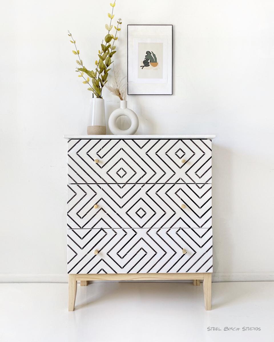 chest of drawers with monochrome geometric pattern on the front