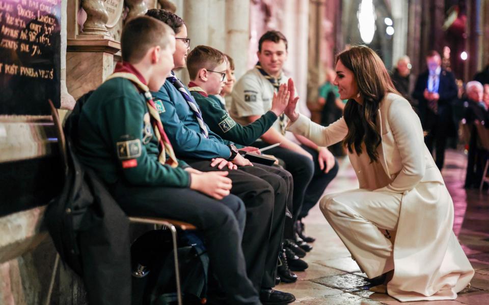 The Princess of Wales high-fives scouts from the 3rd Upton Scout Group in Slough