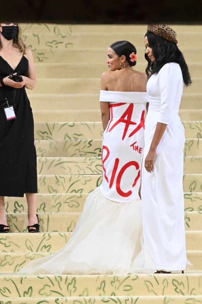 Alexandria Ocasio-Cortez with Aurora James in a custom Brother Vellies gown. - Credit: AP Images