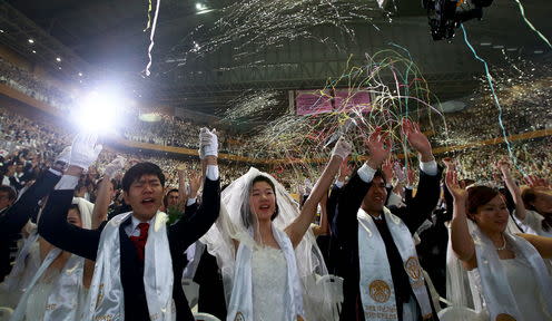 <span class="caption">A mass wedding of 'moonies' – followers of the South Korean leader Sun Myung Moon.</span> <span class="attribution"><span class="source">Jeon Heon-Kyun / EPA</span></span>