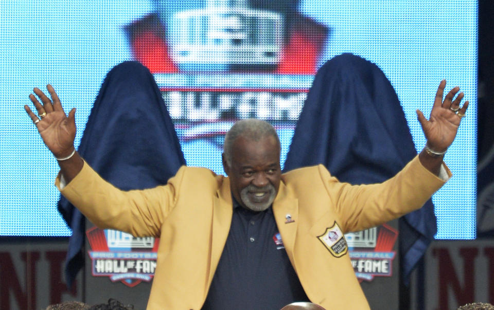 FILE - Rayfield Wright is introduced during the Pro Football Hall of Fame enshrinement ceremony Aug. 2, 2014, in Canton, Ohio. Wright, the Pro Football Hall of Fame offensive tackle nicknamed “Big Cat” who went to five Super Bowls in his 13 NFL seasons with the Dallas Cowboys, has died. He was 76. Wright's family confirmed his death Thursday, April 7, 2022, to the Pro Football Hall of Fame. (AP Photo/David Richard, File)