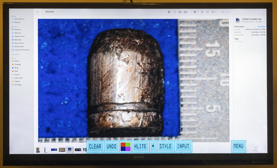 A picture of a bullet is entered as evidence in Hannah Gutierrez-Reed's trial at District Court, Monday, Feb. 26, 2024, in Santa Fe, N.M. Gutierrez-Reed is charged with involuntary manslaughter and tampering with evidence in the October 2021 death of cinematographer Halyna Hutchins during the filming of the Western “Rust.” (Luis Sánchez Saturno/Santa Fe New Mexican via AP, Pool)