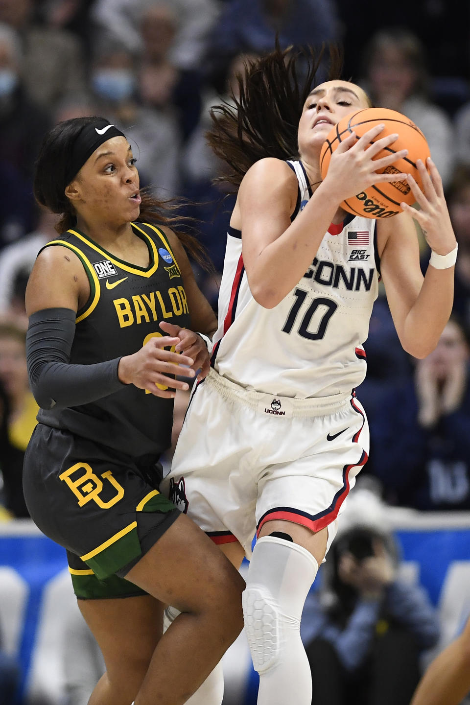 UConn's Nika Muhl (10) is guarded by Baylor's Sarah Andrews in the second half of a second-round college basketball game in the NCAA Tournament, Monday, March 20, 2023, in Storrs, Conn. (AP Photo/Jessica Hill)