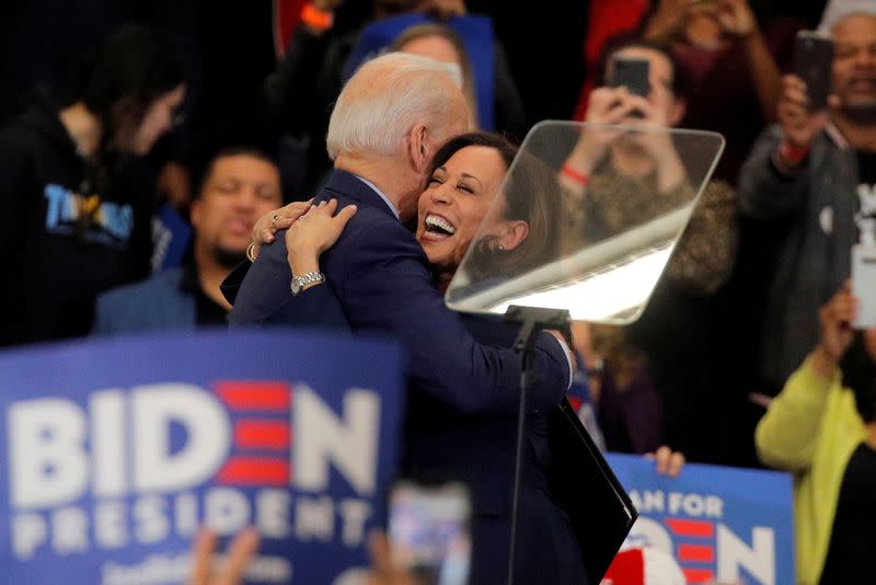 FILE PHOTO: Democratic U.S. presidential candidate and former Vice President Joe Biden is greeted by U.S. Senator Kamala Harris during a campaign stop in Detroit, Michigan