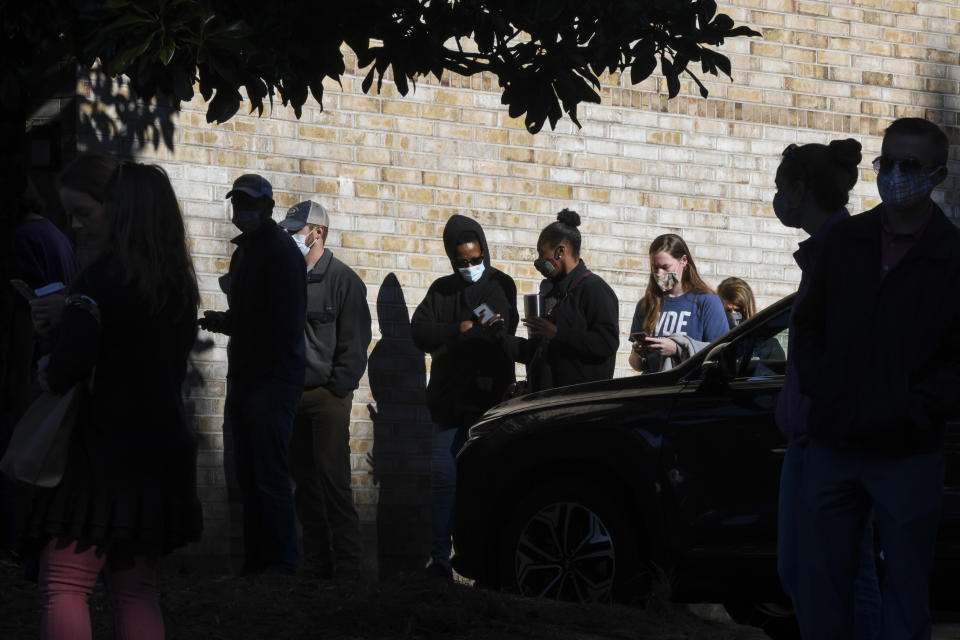 FILE - Voters wait in line to cast their ballots in the 2020 election, Tuesday, Nov. 3, 2020, in Auburn, Ala. After a year of falsehoods surrounding the 2020 presidential election, Republican-led ballot reviews and new voting rules passed by GOP lawmakers, election officials are hoping a smooth 2021 election will demonstrate once again that the system works. (AP Photo/Julie Bennett, File)