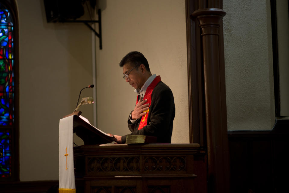 Harry Pangemanan led a service of thanksgiving for being able to return home, and also spoke about fellow Indonesians still detained. (Photo: Alan Chin for Yahoo News)