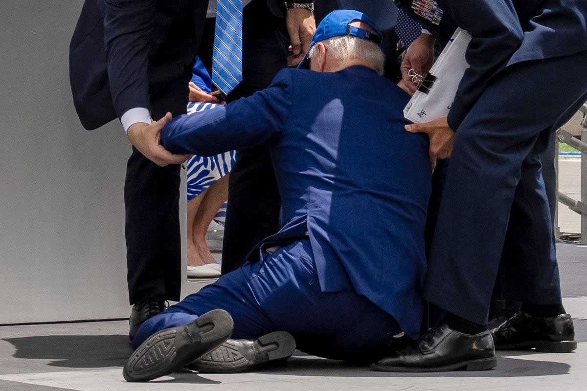 President Joe Biden falls on stage during the 2023 United States Air Force Academy Graduation Ceremony at Falcon Stadium, Thursday, June 1, 2023, at the United States Air Force Academy in Colorado Springs (AP)