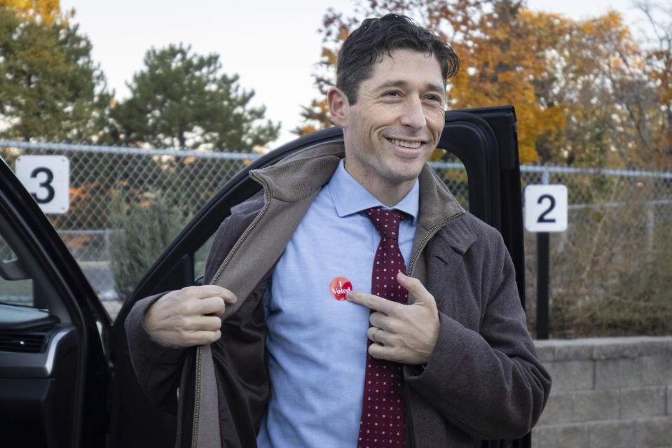 Mayor Jacob Frey casts his vote on Election Day alongside his family at the Marcy Arts Magnet Elementary School on Tuesday, Nov. 2, 2021 in Minneapolis. Voters in Minneapolis are deciding whether to replace the city’s police department with a new Department of Public Safety. The election comes more than a year after George Floyd’s death launched a movement to defund or abolish police across the country. (AP Photo/Christian Monterrosa)