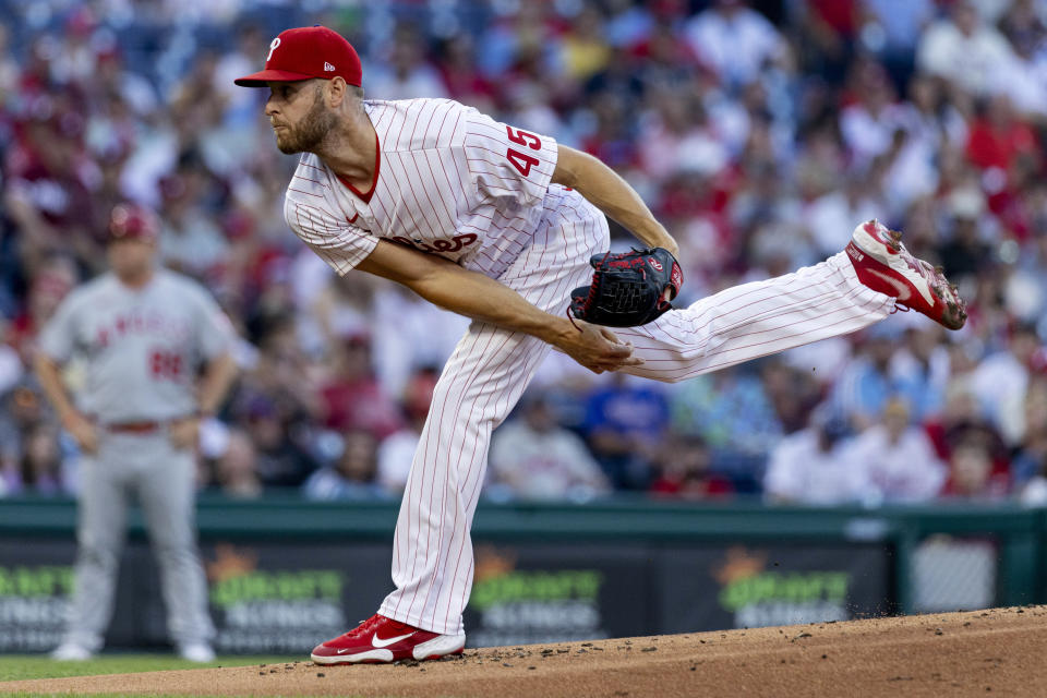 Philadelphia Phillies starting pitcher Zack Wheeler (45) watches a throw during the first inning of the team's baseball game against the Los Angeles Angels, Saturday, June 4, 2022, in Philadelphia. (AP Photo/Laurence Kesterson)
