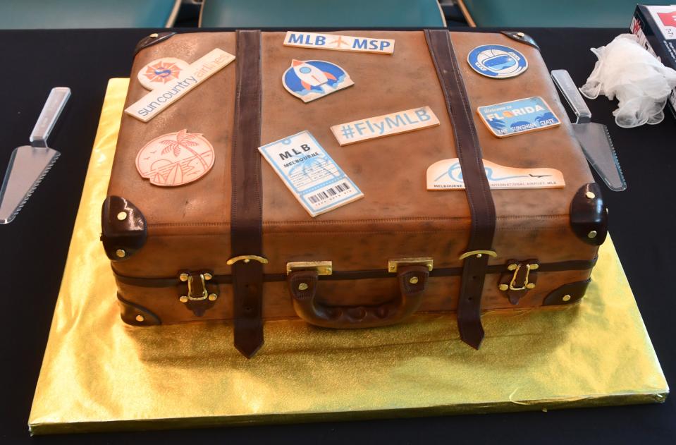 A highly detailed "suitcase cake" greeted the inaugural Sun Country passengers at Gate 7 of the Melbourne airport.