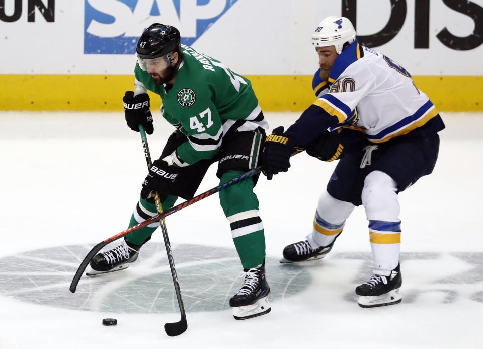 Dallas Stars right wing Alexander Radulov (47) attempts to keep control of the puck while under pressure from St. Louis Blues center Ryan O'Reilly (90) in the third period of Game 6 of an NHL second-round hockey playoff series in Dallas, Sunday, May 5, 2019. (AP Photo/Tony Gutierrez)