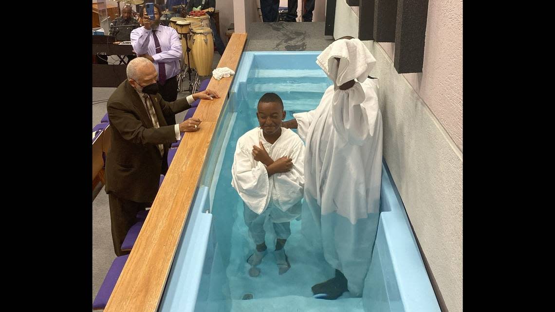 Claude Hodges Jr. prepares to be baptized in fall 2021 at New Hope Baptist Church. The 14-year-old Wichita boy was found fatally shot Monday. 