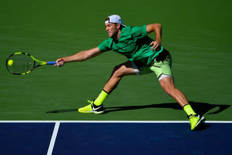 Jack Sock of the United States returns a shot to Kei Nishikori of Japan in the men's quarterfinals match on Day 12 during the BNP Paribas Open at Indian Wells Tennis Garden on March 17, 2017
