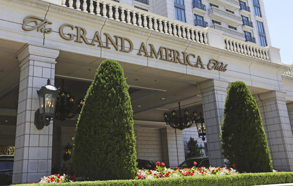 This Sunday, June 23, 2019, photo, shows the Grand America Hotel in Salt Lake City. A lawsuit filed Tuesday, accuses the luxury Grand America Hotel in Salt Lake City of luring workers from the Philippines to a program that promised training and cultural immersion but instead forced them to work long hours doing menial jobs for low pay. (AP Photo/Rick Bowmer)