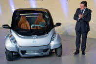 BRUSSELS, BELGIUM - JANUARY 24: EU Commission President Jose Manuel Barroso looks at the first prototype of the HIRIKO electric car, during the global launch of Hiriko Driving Mobility at the EU Commssion headquarters on January 24, 2012 in Brussels, Belgium. The electronic eco-friendly vehicle will be manufactured in deprived areas of cities who take up Hiriko's "social purpose" model. Malmo in Sweden has already signed up to trial Hiriko with Berlin, Barcelona, Vitoria-Gasteiz (the second largest Basque city), San Francisco, and Hong Kong expected to follow suit. (Photo by Geert Vanden Wijngaert/Getty Images)