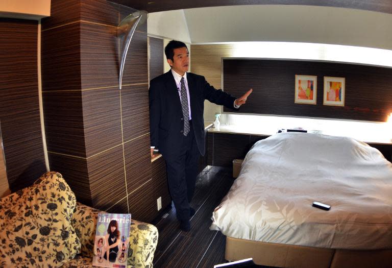 This picture taken on February 10, 2014 shows a love hotel consultant Masakatsu Tsunoda speaking to an AFP reporter in a room of the Two-Way hotel in Tokyo